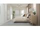 Tranquil bedroom featuring a comfortable bed, neutral tones, and ample natural light at 24863 N 167Th Dr, Surprise, AZ 85387