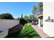 Manicured backyard with outdoor dining area at 25 E San Miguel E Ave, Phoenix, AZ 85012