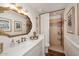 Bathroom featuring a modern vanity, mirror and tiled walk-in shower at 25 E San Miguel E Ave, Phoenix, AZ 85012