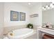 Bathroom featuring a soaking tub and vanity at 25 E San Miguel E Ave, Phoenix, AZ 85012