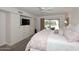 Bedroom with built-in shelves and drawers and a ceiling fan at 25 E San Miguel E Ave, Phoenix, AZ 85012