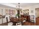 Elegant dining room featuring classic chandelier, dark wood furniture, and natural light perfect for gatherings at 25 E San Miguel E Ave, Phoenix, AZ 85012