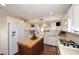 Bright kitchen featuring white cabinetry, butcher block island, and stainless steel appliances at 25 E San Miguel E Ave, Phoenix, AZ 85012
