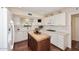 Bright kitchen featuring white cabinetry, butcher block island, and stainless steel appliances at 25 E San Miguel E Ave, Phoenix, AZ 85012