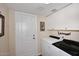 Laundry room with washer and dryer and overhead cabinets at 25 E San Miguel E Ave, Phoenix, AZ 85012