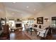 Bright living room with vaulted ceilings, a cozy fireplace, and a seamless transition to outdoor living space at 25 E San Miguel E Ave, Phoenix, AZ 85012