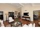 Well-appointed living room with rich hardwood floors, stylish furnishings, and abundant natural light creating an inviting space at 25 E San Miguel E Ave, Phoenix, AZ 85012