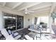 Covered patio with ceiling fan, outdoor seating and access to the backyard at 25 E San Miguel E Ave, Phoenix, AZ 85012