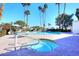 Inviting pool and spa area offering the perfect escape, framed by palm trees and blue skies at 25 E San Miguel E Ave, Phoenix, AZ 85012