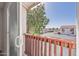 Enjoy neighborhood views from this balcony with dark wood railing and a sliding glass door at 2828 E Waltann Ln # 1, Phoenix, AZ 85032