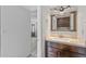 Stylish powder room with custom vanity, updated lighting, and modern fixtures at 2828 E Waltann Ln # 1, Phoenix, AZ 85032