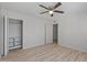 This bedroom features modern light wood flooring, bright white walls, and a large closet at 2828 E Waltann Ln # 1, Phoenix, AZ 85032
