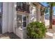 Front exterior of home shows security door, small garden and window with shutters at 2828 E Waltann Ln # 1, Phoenix, AZ 85032