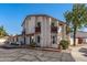 Two-story multi-Gathering home with stucco exterior, red tile roof, and private balconies at 2828 E Waltann Ln # 1, Phoenix, AZ 85032