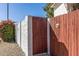 Wood gate and block wall offers privacy and security to the property at 2828 E Waltann Ln # 1, Phoenix, AZ 85032