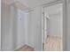 Hallway featuring access to rooms and a spacious closet with bifold doors at 2828 E Waltann Ln # 1, Phoenix, AZ 85032