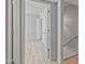 Bright hallway leading to a bedroom with light wood floors at 2828 E Waltann Ln # 1, Phoenix, AZ 85032