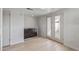 Modern kitchen featuring stainless steel appliances, white cabinets, and access to the patio at 2828 E Waltann Ln # 1, Phoenix, AZ 85032