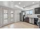 Updated kitchen with modern appliances, white countertops, and access to the patio at 2828 E Waltann Ln # 1, Phoenix, AZ 85032