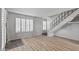 Inviting living room with shutters, modern floors, and stairway to the upper level at 2828 E Waltann Ln # 1, Phoenix, AZ 85032