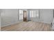Bright living room featuring new light wood floors and freshly painted walls at 2828 E Waltann Ln # 1, Phoenix, AZ 85032