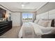 Well-lit bedroom with a king size bed, neutral decor, and a view from the large window at 2843 W Eagle Talon Rd, Phoenix, AZ 85085