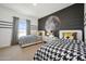 Charming bedroom with two twin beds, playful decor, and a moon-themed accent wall at 2843 W Eagle Talon Rd, Phoenix, AZ 85085
