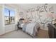 Stylish bedroom featuring modern art, a large window, and chic decor at 2843 W Eagle Talon Rd, Phoenix, AZ 85085