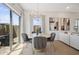 Cozy dining area with modern chandelier and sliding glass door to the patio at 2843 W Eagle Talon Rd, Phoenix, AZ 85085