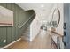 Welcoming entryway featuring wood-look tile floors and a staircase to the second level at 2843 W Eagle Talon Rd, Phoenix, AZ 85085