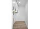 Laundry room features white cabinets, wood-look floors, and convenient washer/dryer connections at 3417 E Lupine Ave, Phoenix, AZ 85028