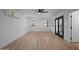 Bright living room with modern ceiling fan, sleek flooring, fresh paint, and outdoor view at 3417 E Lupine Ave, Phoenix, AZ 85028
