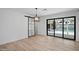Living room with a sliding glass door leading to the backyard pool and a modern sliding barn door at 3417 E Lupine Ave, Phoenix, AZ 85028