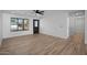 Bright and spacious living room with wood-look floors, modern lighting and a glass paneled front door at 3417 E Lupine Ave, Phoenix, AZ 85028