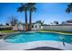Backyard pool with mature landscaping and desert modern style home at 3417 E Lupine Ave, Phoenix, AZ 85028