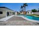 Backyard pool with mature landscaping and desert modern style home at 3417 E Lupine Ave, Phoenix, AZ 85028