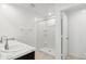 Bright bathroom featuring double sinks, a walk-in shower, and neutral walls at 35474 N Breezy Ln, San Tan Valley, AZ 85140