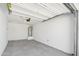 Clean garage interior showcasing ample space, and modern lighting fixtures at 35474 N Breezy Ln, San Tan Valley, AZ 85140