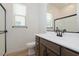 Updated bathroom showcasing modern fixtures, white countertop, shower, and wood-look flooring at 40165 N Alameda Dr, San Tan Valley, AZ 85140