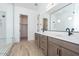 Bright bathroom featuring double sinks, modern fixtures, and a spacious walk-in shower at 40165 N Alameda Dr, San Tan Valley, AZ 85140