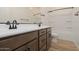 Modern bathroom featuring dual sink vanity, and tub shower combo at 40165 N Alameda Dr, San Tan Valley, AZ 85140