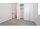 Bright bedroom featuring white walls, carpet floors, closet, and en-suite access at 40165 N Alameda Dr, San Tan Valley, AZ 85140
