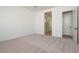 Bedroom with neutral carpet, baseboard trim, and ensuite bathroom access at 40165 N Alameda Dr, San Tan Valley, AZ 85140