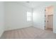 Spacious bedroom with carpet flooring, white walls, window, and closet at 40165 N Alameda Dr, San Tan Valley, AZ 85140