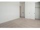 Neutral bedroom with carpet flooring, white walls, closet, and an en-suite bathroom at 40165 N Alameda Dr, San Tan Valley, AZ 85140