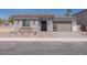 Beautiful single-story home with a modern design, desert landscaping, and a two-car garage at 40165 N Alameda Dr, San Tan Valley, AZ 85140