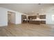Spacious kitchen with dark wood cabinets, stainless appliances, island, and tile flooring at 40165 N Alameda Dr, San Tan Valley, AZ 85140