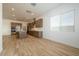Open concept kitchen with stainless steel appliances, a large island, and wood look ceramic tile flooring at 40165 N Alameda Dr, San Tan Valley, AZ 85140