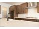Close-up of the kitchen island featuring white counters, stylish faucet, and stainless steel appliances at 40165 N Alameda Dr, San Tan Valley, AZ 85140