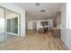 Open-concept kitchen with island, stainless appliances, and light wood-look tile floors at 40165 N Alameda Dr, San Tan Valley, AZ 85140